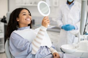 concept image of woman at dentist for teeth whitening
